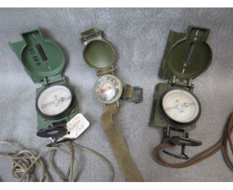 A US WRIST COMPASS DATED 1952, plus two marching compasses dated 1979 and 1986 (3)