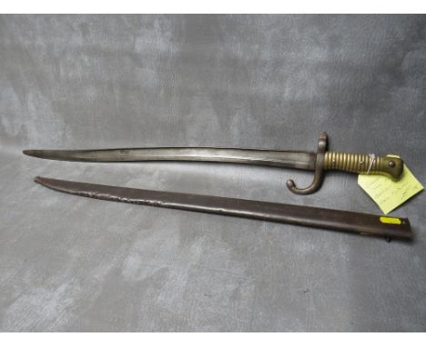 A FRENCH 19TH CENTURY CHASSPOT BAYONET, with brass grip, in steel scabbard, L 70.5 cm