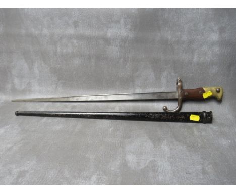 A FRENCH GRAS BAYONET, dated 1879 to spine, with wooden grips, in steel scabbard, L 65.5 cm