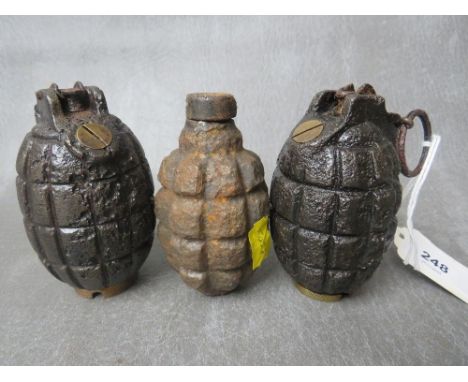 TWO MILLS BOMB GRENADES, dated 1916 A/F, along with another grenade, all A/F, all inert (3)