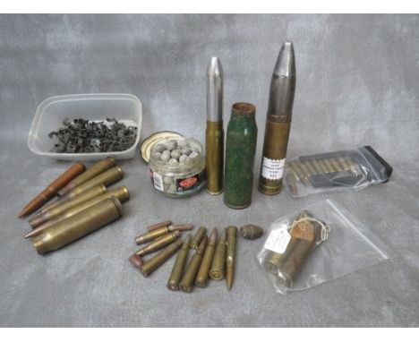 A BOX OF INERT SHELL AND BULLET CASES, to include a 30mm armour piercing round, SA80 rounds in speed loader etc. (All inert)