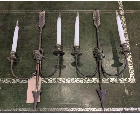 WALL SCONCES, a pair, 31cm W x 64cm H, of arrow form with ram's head detail. (2) 