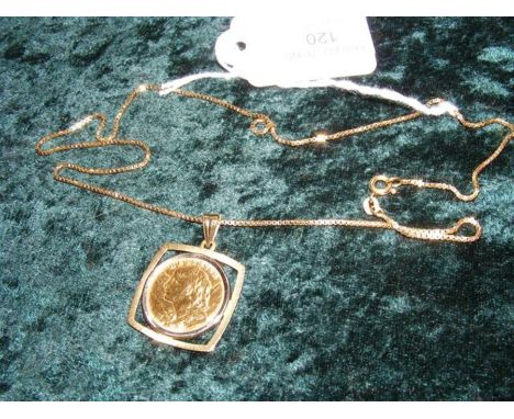 A twenty franc 1927 gold swiss coin in gold mount and chain