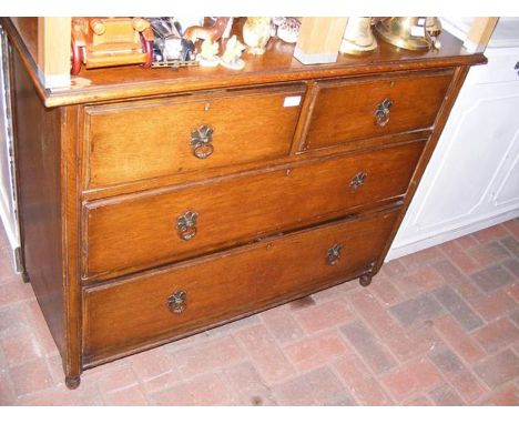 An oak chest of two short and two long drawers - width 107cm 