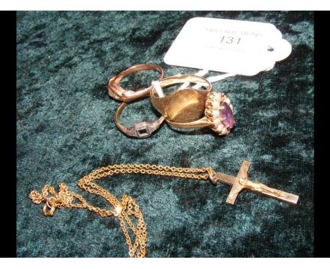 Four dress rings, gold cross on chain