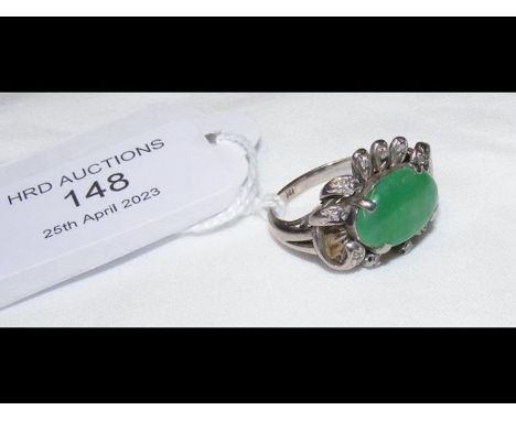 A jade and diamond ring in white gold settingCONDITION REPORTSize of jade 0.8cm x 1.2cm weight 4.9gCondition disclaimerOur te