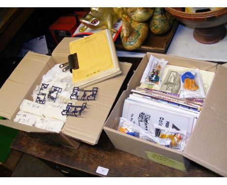 A box of Airfix model men, together with a quantity of die cast model vehicle catalogues, etc. 