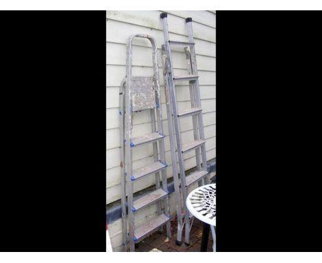 Two aluminum step ladders