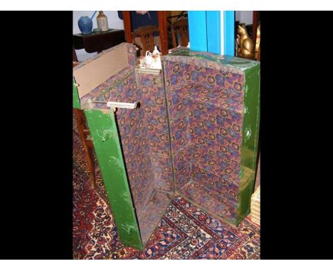 A green travelling trunk with shelves to interior