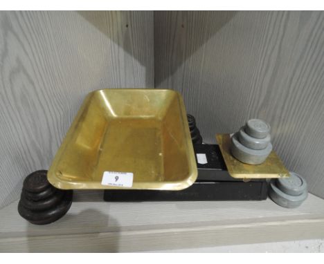 A set of vintage balance scales cast and brass with weights