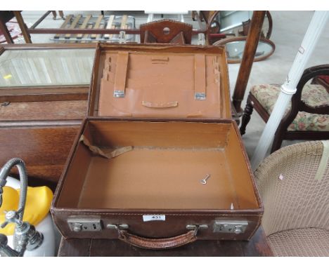 A vintage leather workcase, tooled initials ZPF