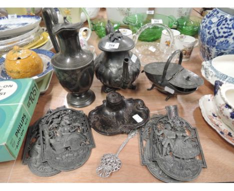 A selection of vintage pewter wares and cast ink well