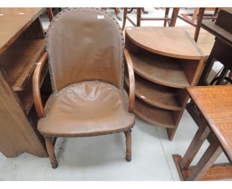 An early 20th Century oak framed armchair and a corner shelf