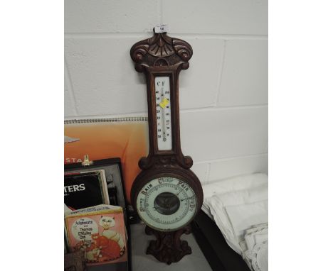 A vintage black forrest style barometer with enamel facebarometer height 29.5"Thermoneter heigh 8.25", width 1.5"glass barome