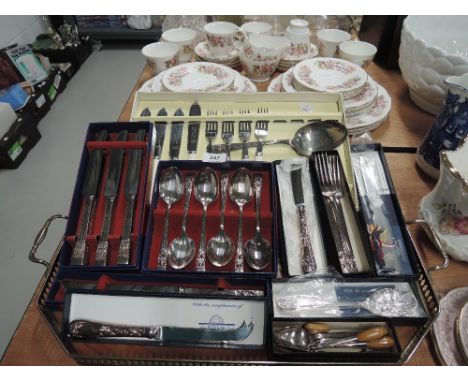 A selection of vintage flatware cutlery and table items all boxed as new 