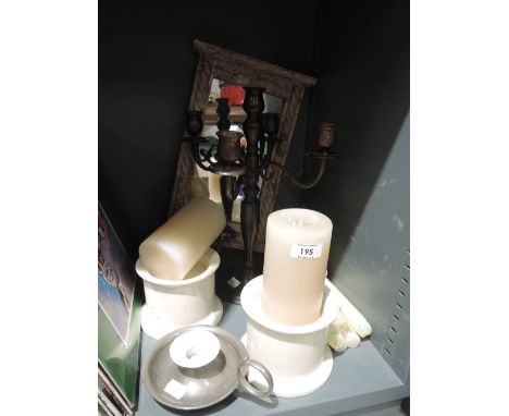 A selection of modern candles and candlestick holders