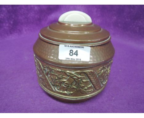 An early 20th century tea caddy with copper and brass body