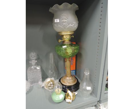 A selection of vintage lighting and oil burning lamp with green glass well