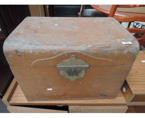 A small vintage tin trunk