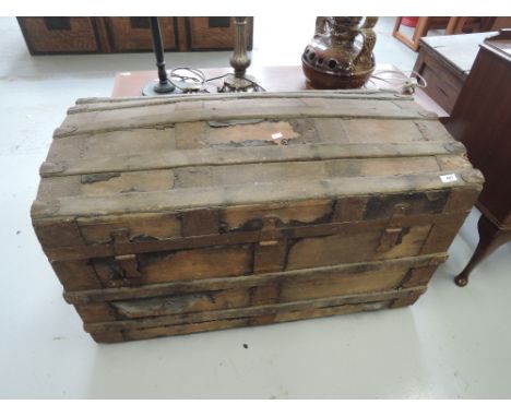 A vintage dome top Seamen's style trunk