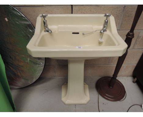 A vintage pedestal washbasin