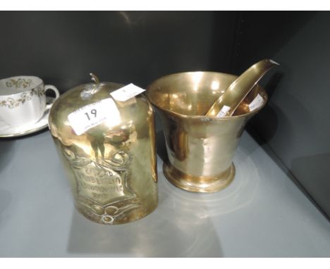 A vintage brass cast apothecary mortar and similar brass bell