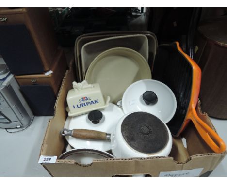 A selection of vintage pots and pans some by Le Creuset