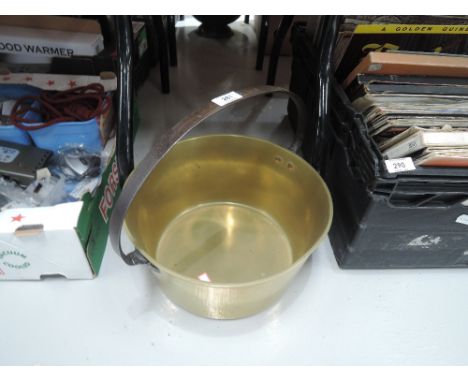 A vintage brass cast jam pan