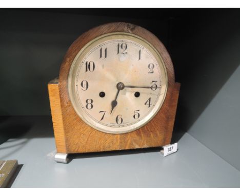 A vintage oak bodied mantle clock with chime
