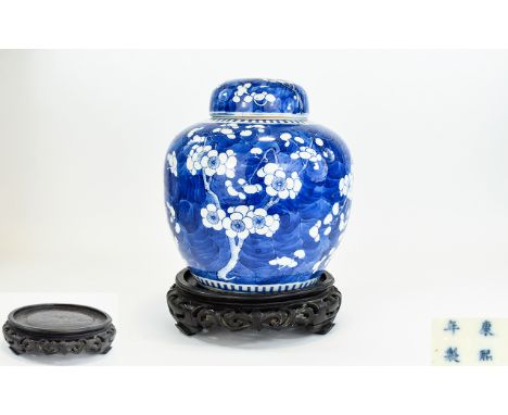 Chinese - 19th Century Bulbous Shaped Blue and White Ginger Jar, Kangxi Character Marks to Underside, Decorated In The Prunus