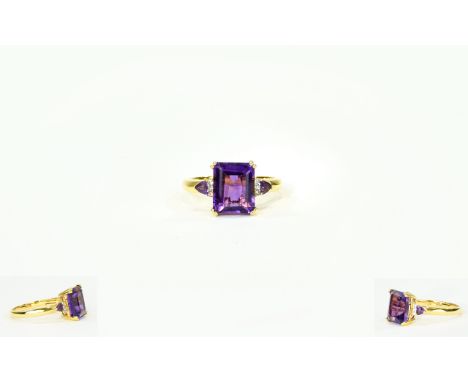 Amethyst and Natural White Zircon Ring, an octagon cut, rich purple amethyst of 4.75cts, flanked by small, natural white zirc