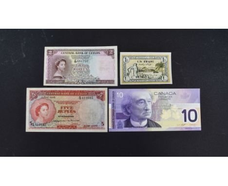 A Collection of Assorted Bank Notes. Comprises 1/ Central Bank of Ceylon Five Rupees Bank Note, Date 16th October 1954, Queen