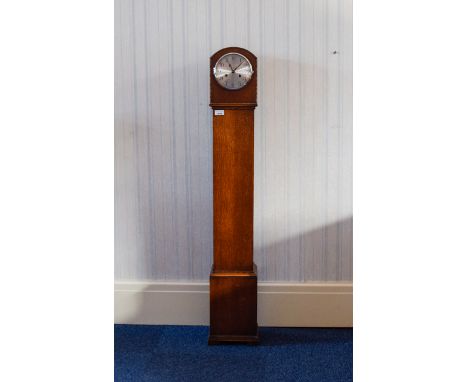 Grand Daughter Clock Oak cased, possibly 1930's, pretty clock with beading detail to case. Silver face with large numerals. A