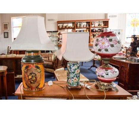 A Collection Of Table Lamps Three in total to include reproduction oil lamp with ornate metal base and pink and white floral 