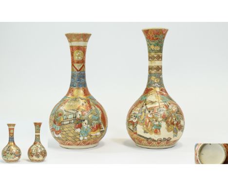 Japanese - Well Decorated Pair of Satsuma Bottle Shaped Vases - Meiji Period, with Painted and Enamel Figures within Gold Pai