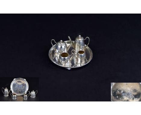 A Miniature Silver 5 Piece Tea and Coffee Set. Comprises Circular Silver Tray, Teapot, Coffee Pot, Milk Jug and Sugar Bowl. H