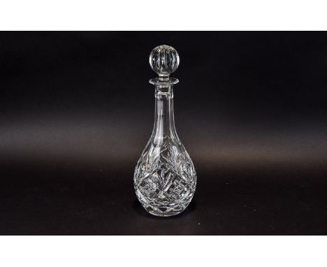 Cut Glass Decanter with star cut base and stopper.