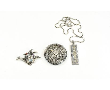 Antique Silver Finely Worked Compact. Of circular form, 1.75 inch diameter. Also a stone set antique silver brooch in floral 
