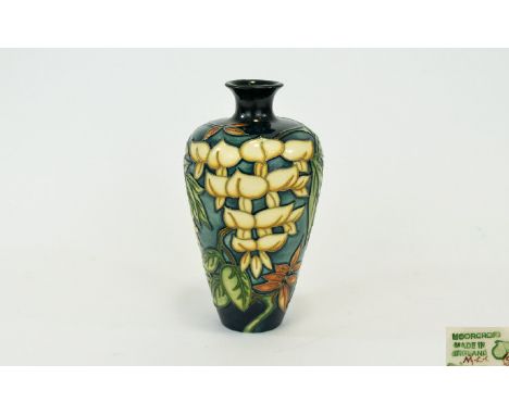 Moorcroft Collectors Club Modern Tube lined Vase. 'Yellow Wisteria' design. Designer Phillip Gibson, circa 1990's. 6.5 inches