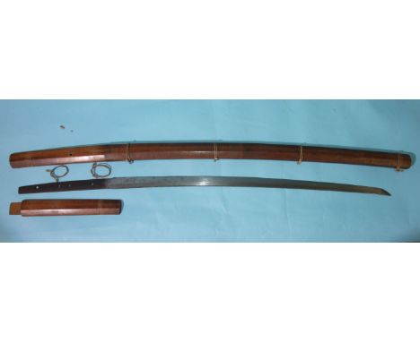 An antique Japanese sword, the signed tang with four holes, the 5mm thick 65cm blade with overall light surface corrosion, (8