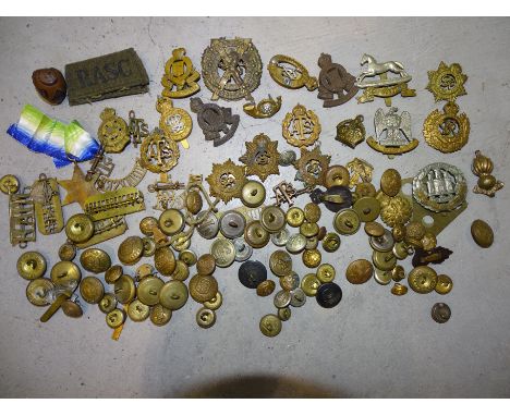 A collection of military cap badges, including Northamptonshire Regiment, West Yorkshire, Royal Scots Greys, military and oth