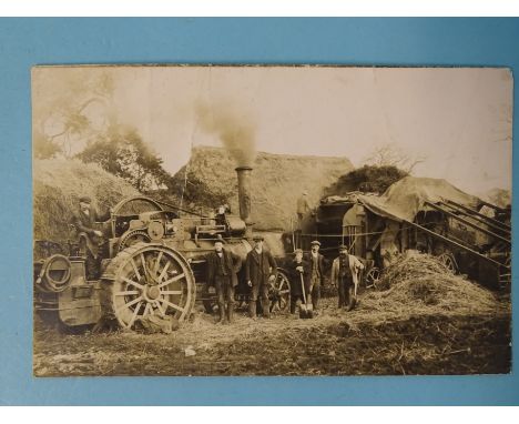 An album of approximately 60 postcards of rural subjects, including two RPs of threshing using a steam traction engine, harve