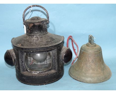 A brass ship's bell, 18cm high, 17.5cm diameter and a black-painted metal 'bull's eye' hand lamp, 30cm high overall, (2). 