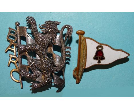 A silver BARC (British Automobile Racing Club) badge with marcasite-set lion over a pierced chequered flag and a small lapel 