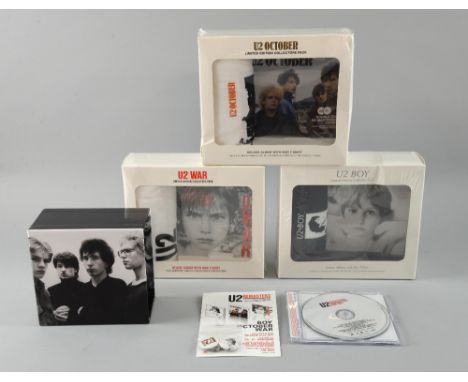 U2 Promotional items including, the first 3 albums remastered in presentation boxes with t shirts, CD holder, promo sampler C