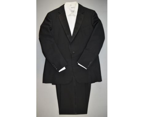 A complete evening wear outfit, including black tuxedo / dinner suit worn by Sir Christopher Lee to numerous events, premiere