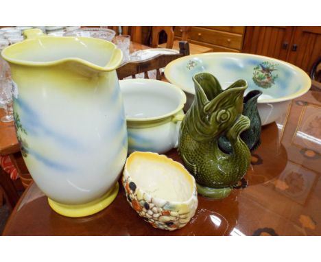 A vintage jug and basin set decorated with birds and lemon yellow boarder and two fish gluggle jugs 