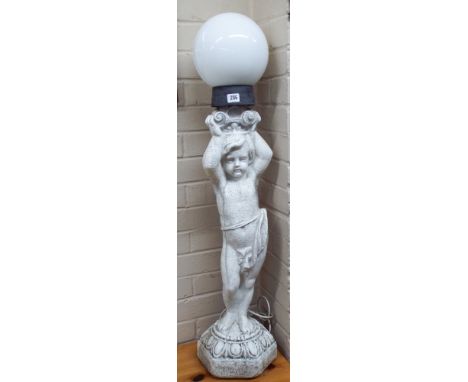 A cherub lamp with globe shade in a faux marble 