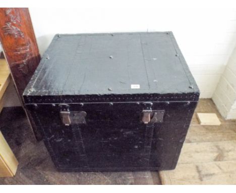 An old canvas black painted travelling trunk 