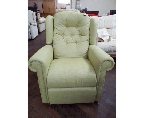A modern lime green button back manual recliner armchair 